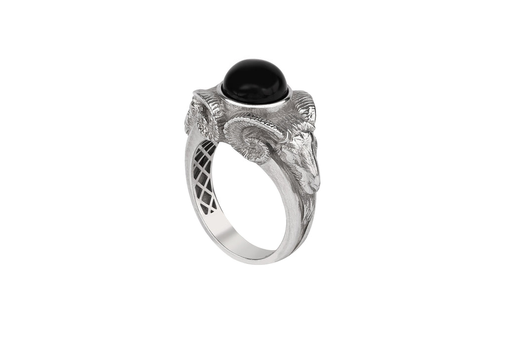 Silver ram ring with a black gemstone on a white background