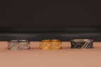 three rings in order: silver, gold-plated, and oxidized