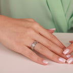 Woman with manicured nails and a gold ring