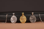 Three Crown of thorn Jesus pendants on a black and brown gradient background