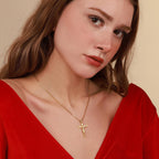 Gold vermeil crucifix pendant necklace worn by woman with red dress