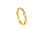 Gold ring with diamond accents on a white background