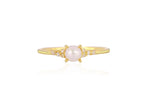 Gold ring with a pearl and small diamonds on a white background